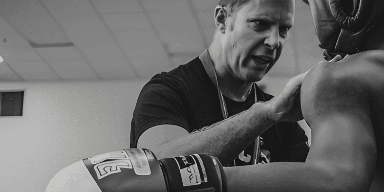 Sample chat dialog of a user asking the AI, who won the most fights by knock-out. The AI answers 'I'll gladly answer that.'